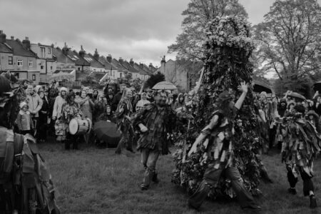 Dance around the green man at the end of the parade